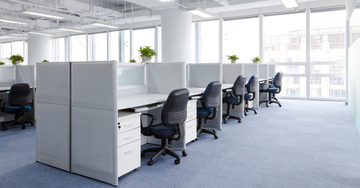 Empty office with a line of desks