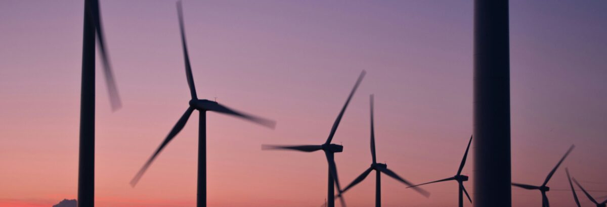 Remote wind farm turbines connected via LTE and 5G networks for real-time monitoring and data analysis.